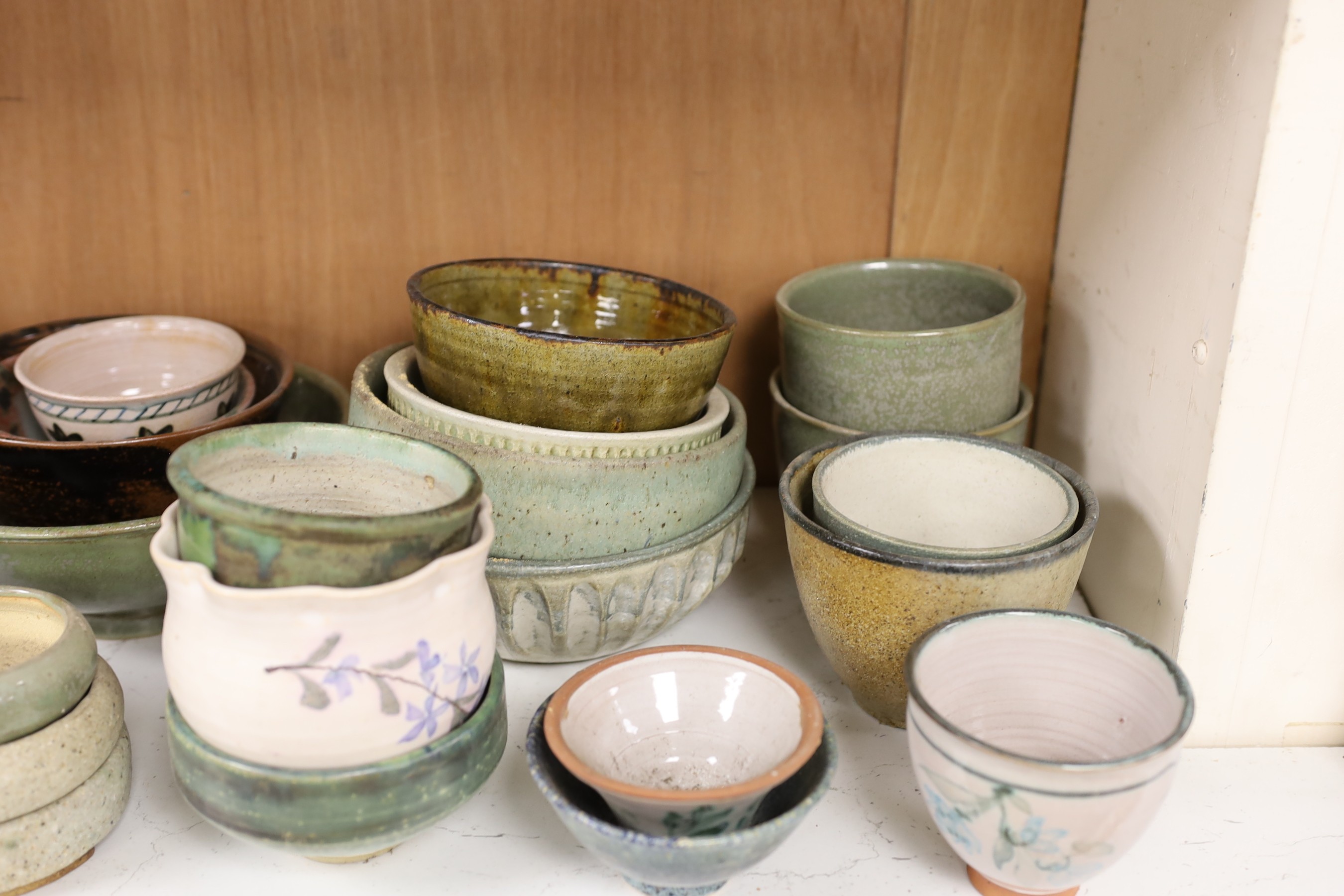 A large quantity of British studio pottery bowls and dishes, to include a vast amount by Susan Threadgold